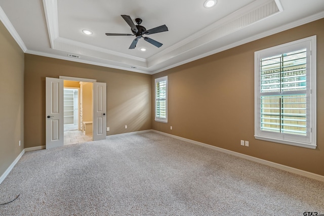 unfurnished room featuring a tray ceiling, crown molding, carpet flooring, ceiling fan, and recessed lighting