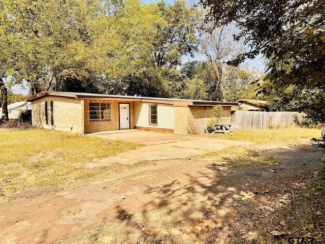 single story home featuring a patio