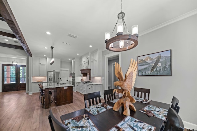 14607 Reserve Ct, Tyler, TX 75707 - dining space featuring a chandelier, recessed lighting, hardwood / wood-style floors, and ornamental molding