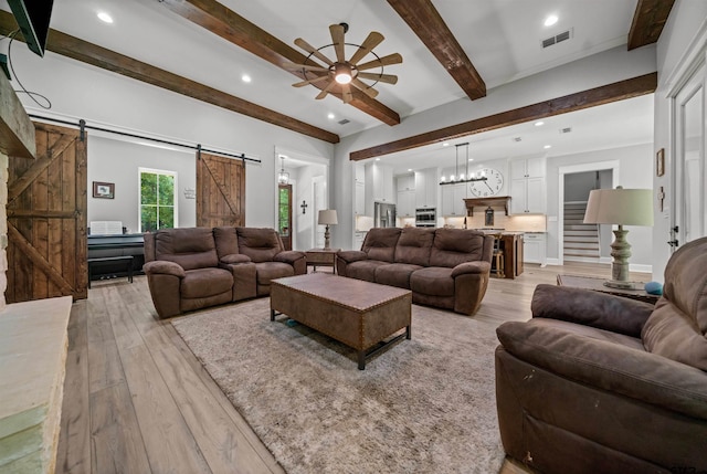 14607 Reserve Ct, Tyler, TX 75707 - living room with a barn door, ceiling fan, light wood-type flooring, beamed ceiling, and recessed lighting