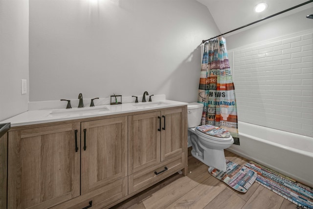 14607 Reserve Ct, Tyler, TX 75707 - bathroom featuring double vanity, shower / bath combo, wood finished floors, and vaulted ceiling