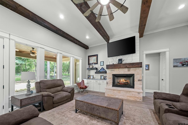 14607 Reserve Ct, Tyler, TX 75707 - living room featuring a ceiling fan, beamed ceiling, a stone fireplace, wood finished floors, and recessed lighting