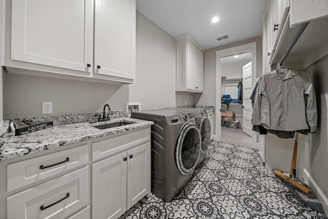 14607 Reserve Ct, Tyler, TX 75707 - laundry room with cabinet space, washer and dryer, light tile patterned flooring, and recessed lighting