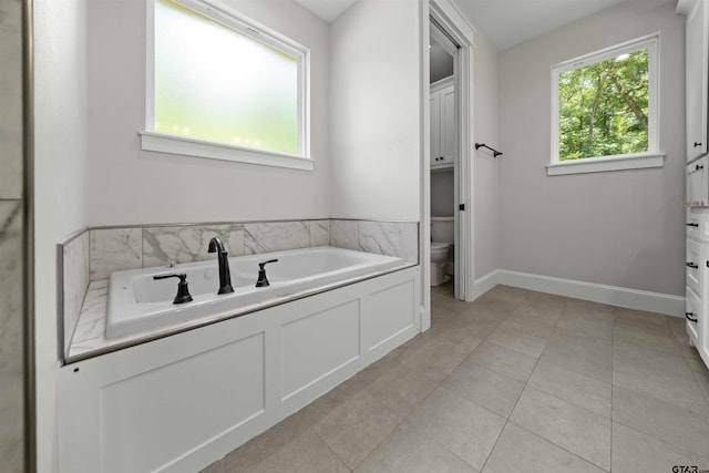 14607 Reserve Ct, Tyler, TX 75707 - full bathroom with a garden tub and tile patterned flooring