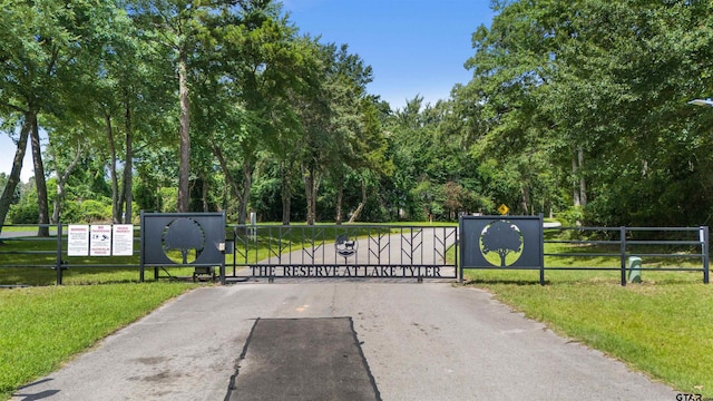 14607 Reserve Ct, Tyler, TX 75707 - gate with view of scattered trees