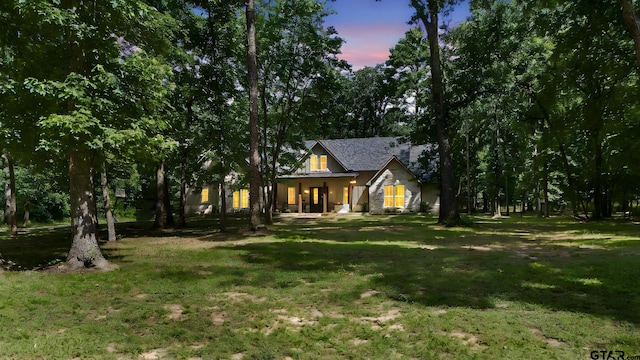 14607 Reserve Ct, Tyler, TX 75707 - view of front of home featuring a porch and a yard
