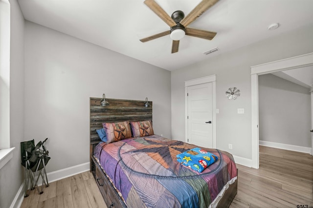 14607 Reserve Ct, Tyler, TX 75707 - bedroom with light wood-style floors and ceiling fan