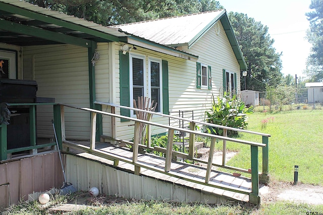 view of property exterior with a lawn