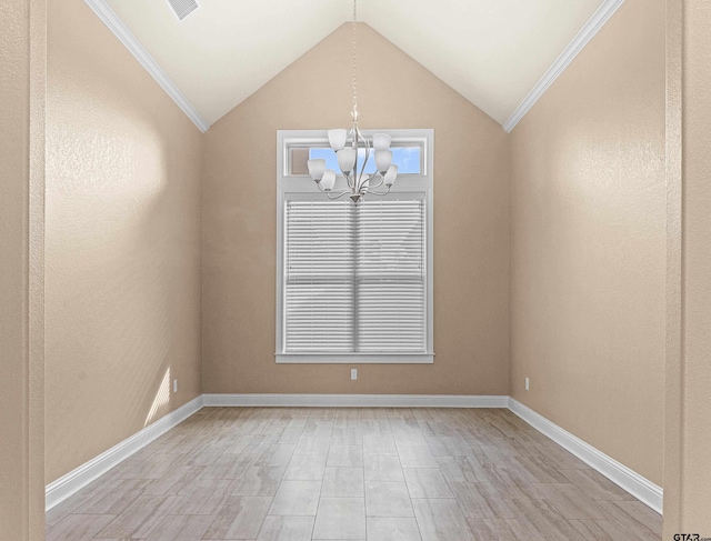 unfurnished room featuring ornamental molding, lofted ceiling, and a notable chandelier