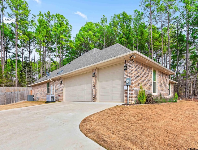 view of property exterior featuring a garage and central air condition unit