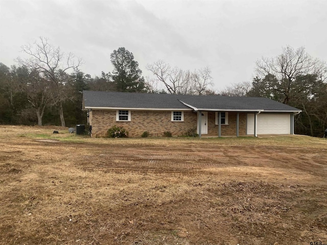 ranch-style house featuring a garage