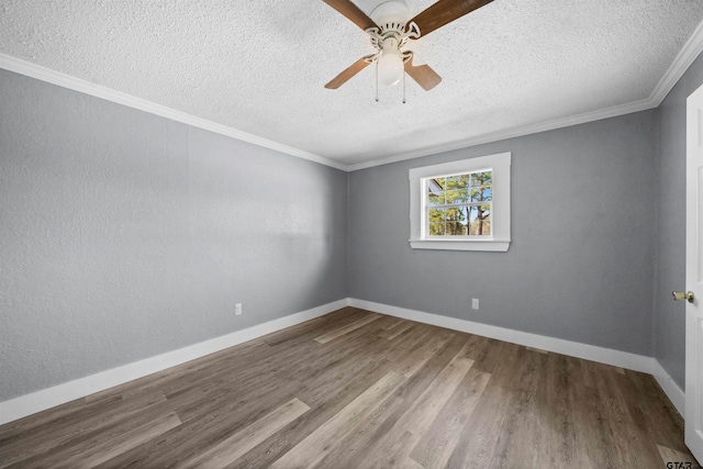 empty room featuring wood-type flooring, a textured ceiling, ceiling fan, and crown molding