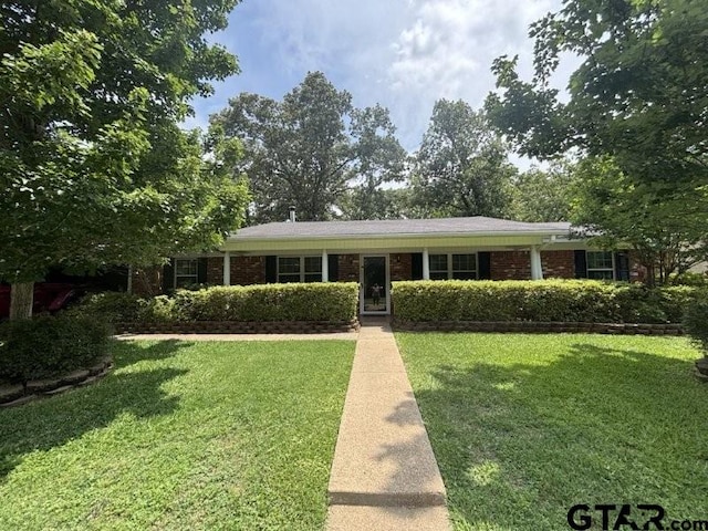 3010 Cook Ln, Longview, TX 75602 - ranch-style home featuring a front yard and brick siding