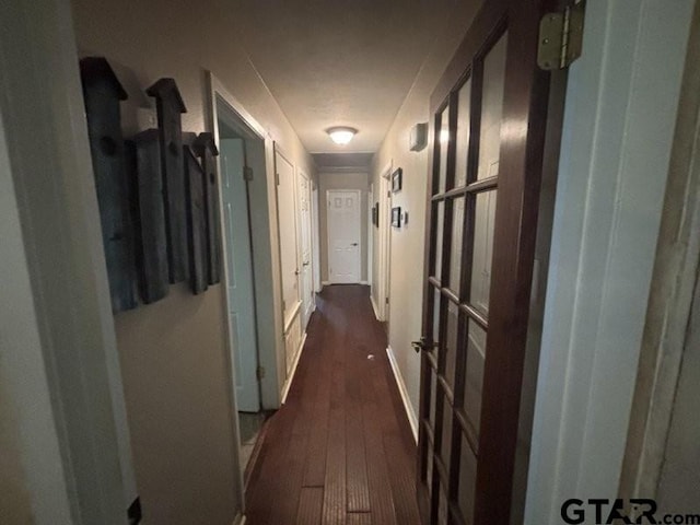 3010 Cook Ln, Longview, TX 75602 - hall featuring dark wood-style floors and baseboards