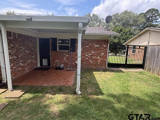 3010 Cook Ln, Longview, TX 75602 - view of home's exterior featuring brick siding and a gate