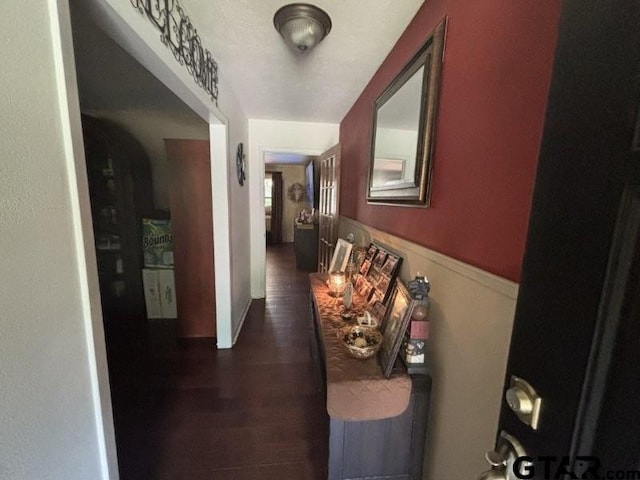 3010 Cook Ln, Longview, TX 75602 - hallway featuring dark wood-style floors and wainscoting