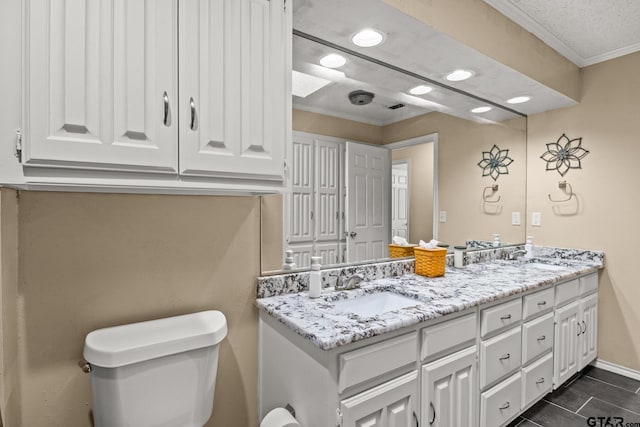 1801 N Fairway, Mount Pleasant, TX 75455 - bathroom with double vanity, crown molding, recessed lighting, and tile patterned floors