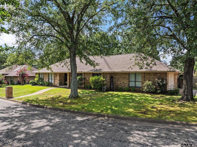 1801 N Fairway, Mount Pleasant, TX 75455 - view of front of house with a front lawn and brick siding