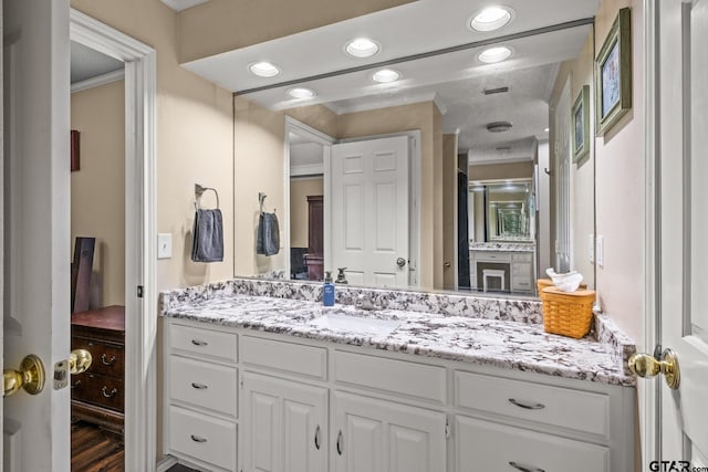 1801 N Fairway, Mount Pleasant, TX 75455 - bathroom featuring vanity, crown molding, and recessed lighting