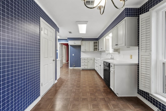kitchen with dishwasher, a sink, light countertops, white cabinetry, and open shelves