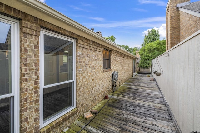 view of property exterior featuring brick siding