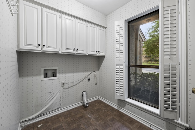 laundry room with cabinet space, hookup for a washing machine, hookup for an electric dryer, baseboards, and wallpapered walls