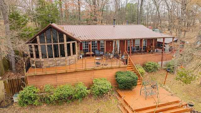 back of house with a wooden deck