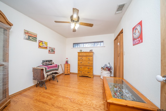 office area with ceiling fan and light hardwood / wood-style flooring