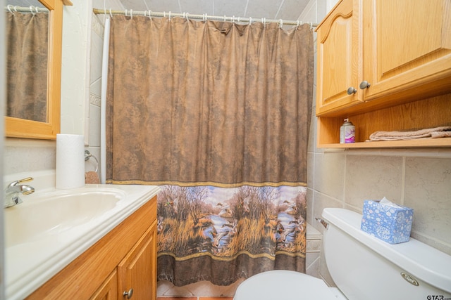 bathroom featuring vanity, toilet, and walk in shower