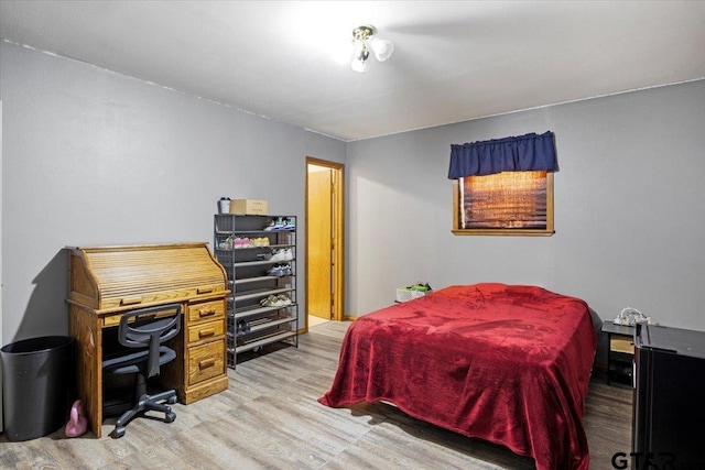 bedroom featuring light wood-style flooring