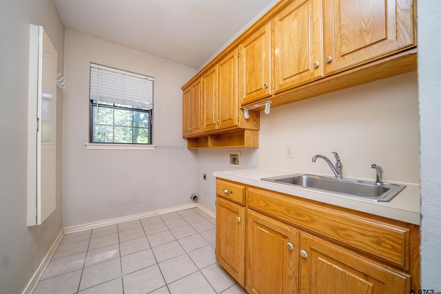 9211 Elm Tree Cir, Tyler, TX 75703 - laundry area with cabinet space, washer hookup, light tile patterned flooring, hookup for an electric dryer, and baseboards