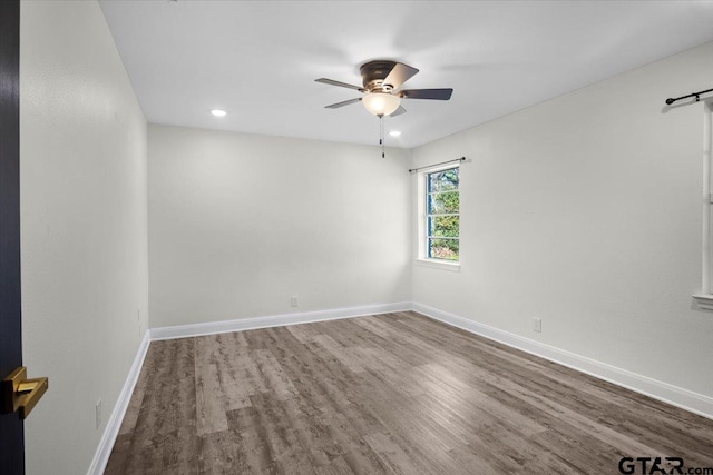 spare room with recessed lighting, baseboards, a ceiling fan, and wood finished floors