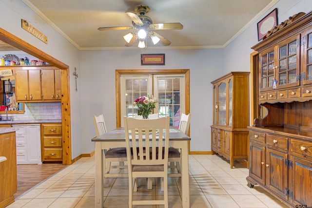 dining room featuring light tile patterned floors, ceiling fan, and ornamental molding