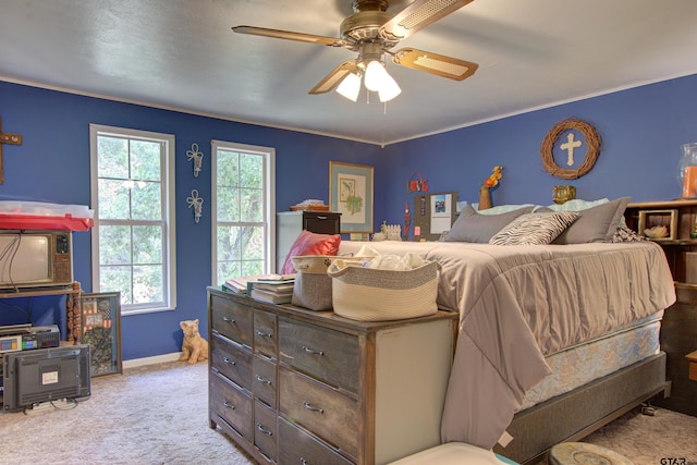 bedroom with ceiling fan and light colored carpet