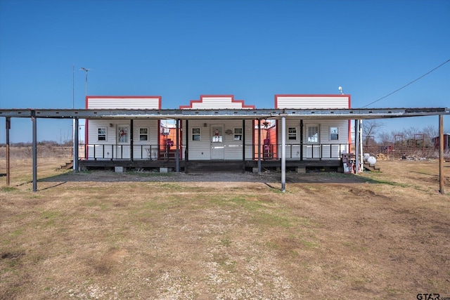 view of front of house with a porch and a front lawn