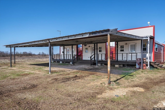 view of front of home featuring covered porch and metal roof