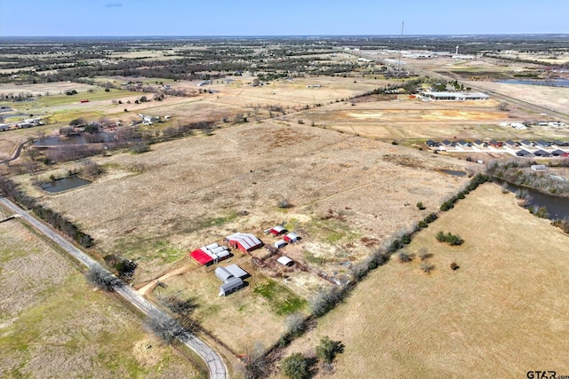 birds eye view of property featuring a rural view