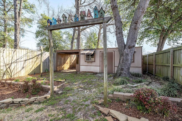 view of outbuilding featuring an outdoor structure and a fenced backyard