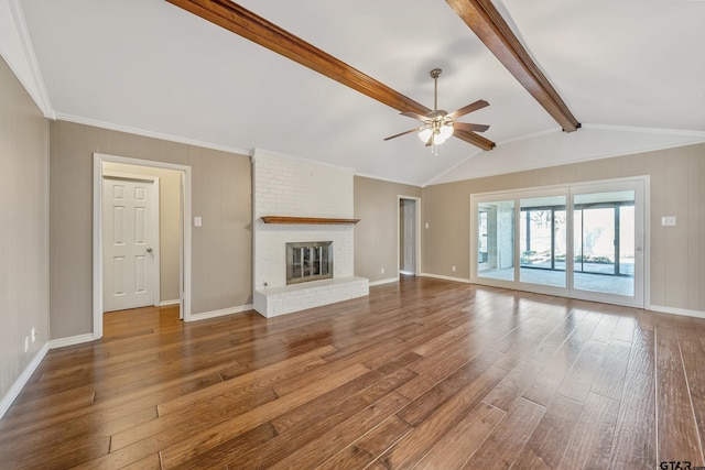 unfurnished living room featuring a fireplace, vaulted ceiling with beams, a ceiling fan, and wood-type flooring