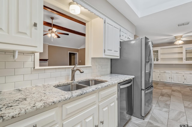 kitchen featuring a ceiling fan, visible vents, appliances with stainless steel finishes, and a sink