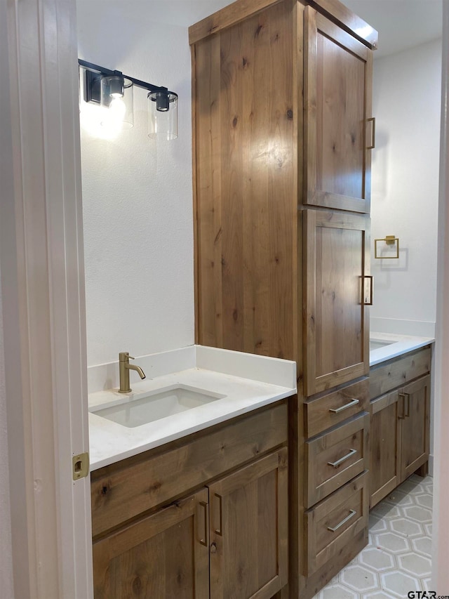 bathroom with vanity and tile patterned floors