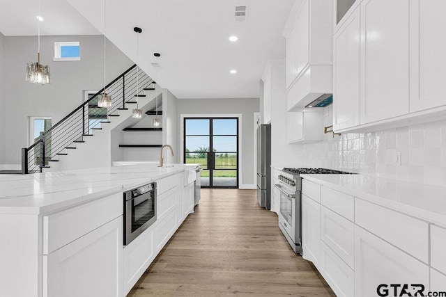 3255 Vz County Road 2120, Canton, TX 75103 - kitchen with appliances with stainless steel finishes, healthy amount of natural light, white cabinets, decorative backsplash, and recessed lighting