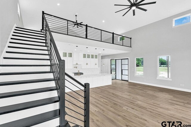 3255 Vz County Road 2120, Canton, TX 75103 - stairway featuring a high ceiling, a ceiling fan, wood finished floors, baseboards, and recessed lighting