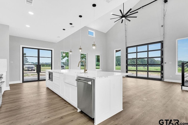 3255 Vz County Road 2120, Canton, TX 75103 - kitchen with dishwasher, a sink, baseboards, high vaulted ceiling, and plenty of natural light