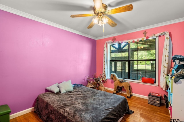 2711 N Fm 250, Hughes Springs, TX 75656 - bedroom featuring ornamental molding, wood finished floors, and ceiling fan