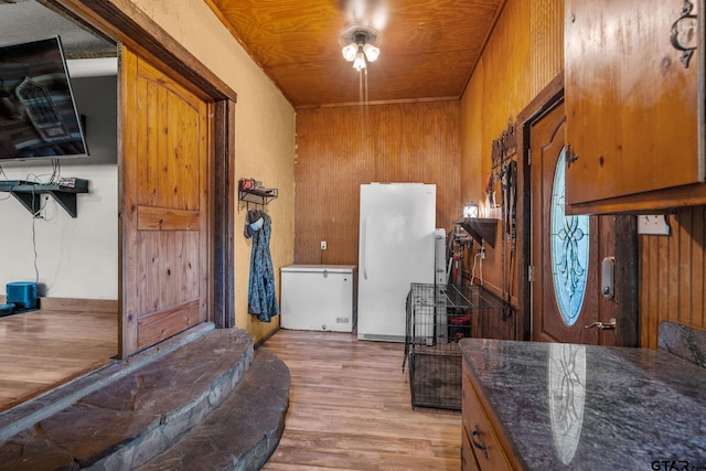 2711 N Fm 250, Hughes Springs, TX 75656 - entrance foyer with light wood finished floors and wooden walls