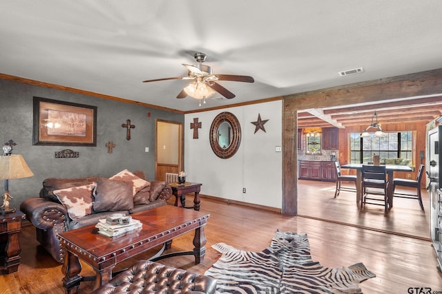 2711 N Fm 250, Hughes Springs, TX 75656 - living area featuring light wood-style flooring, a ceiling fan, and ornamental molding