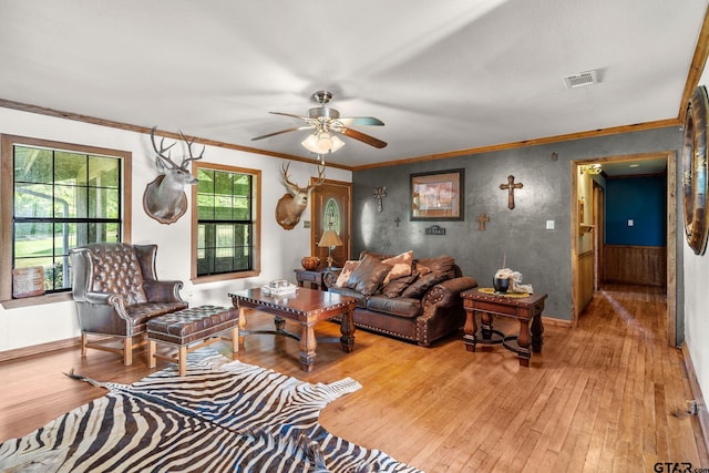 2711 N Fm 250, Hughes Springs, TX 75656 - living area with hardwood / wood-style floors, ceiling fan, and ornamental molding