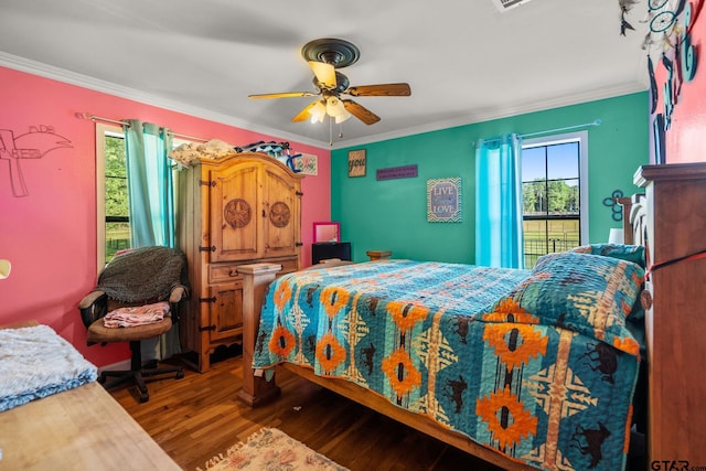 2711 N Fm 250, Hughes Springs, TX 75656 - bedroom with wood finished floors, crown molding, and ceiling fan