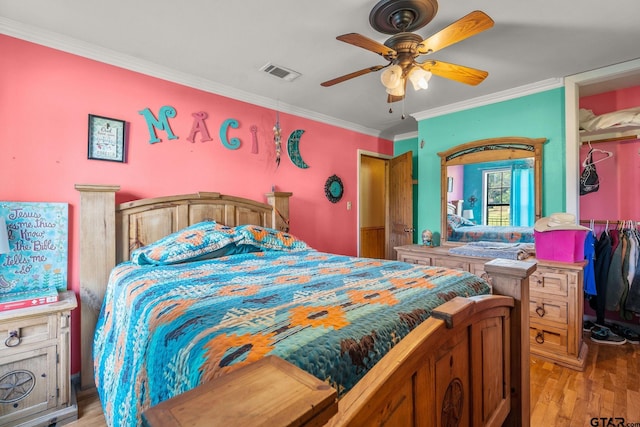 2711 N Fm 250, Hughes Springs, TX 75656 - bedroom with crown molding, light wood finished floors, and ceiling fan